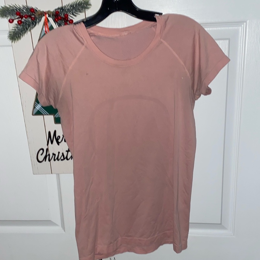 Pink lululemon swiftly tech size eight gently used.